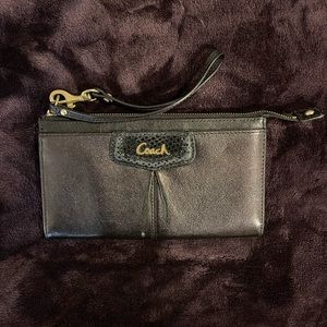 Coach black zip wristlet with gold accents